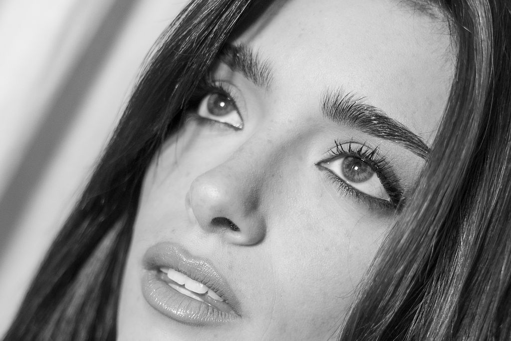 Black-and-white beauty close-up against a white seamless