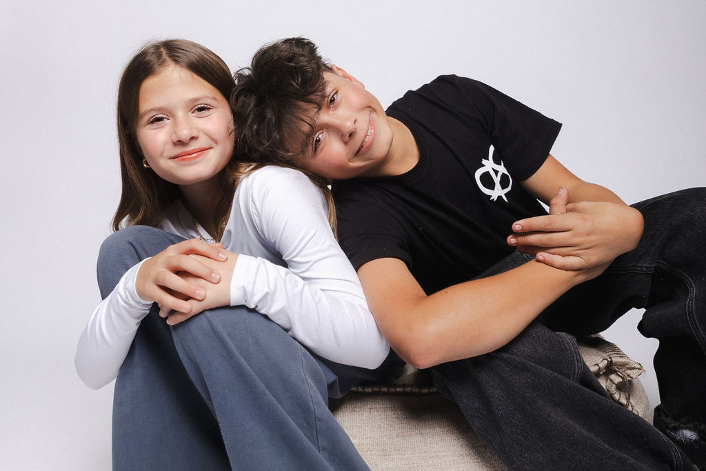 Sibling portrait on a white backdrop