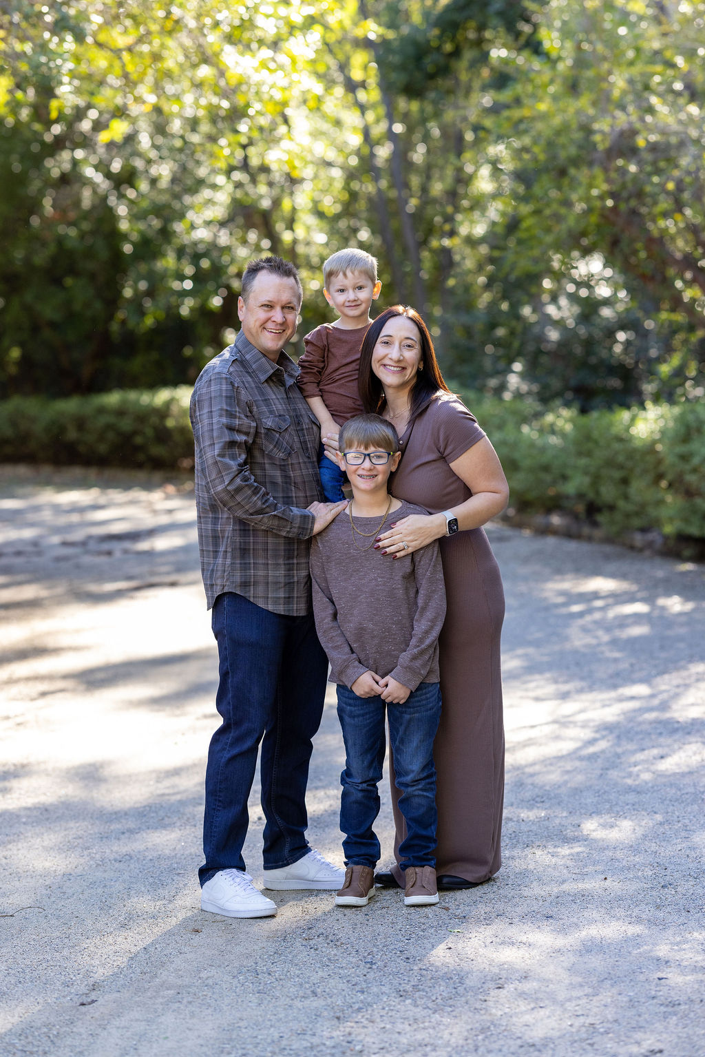 Family walking a park path